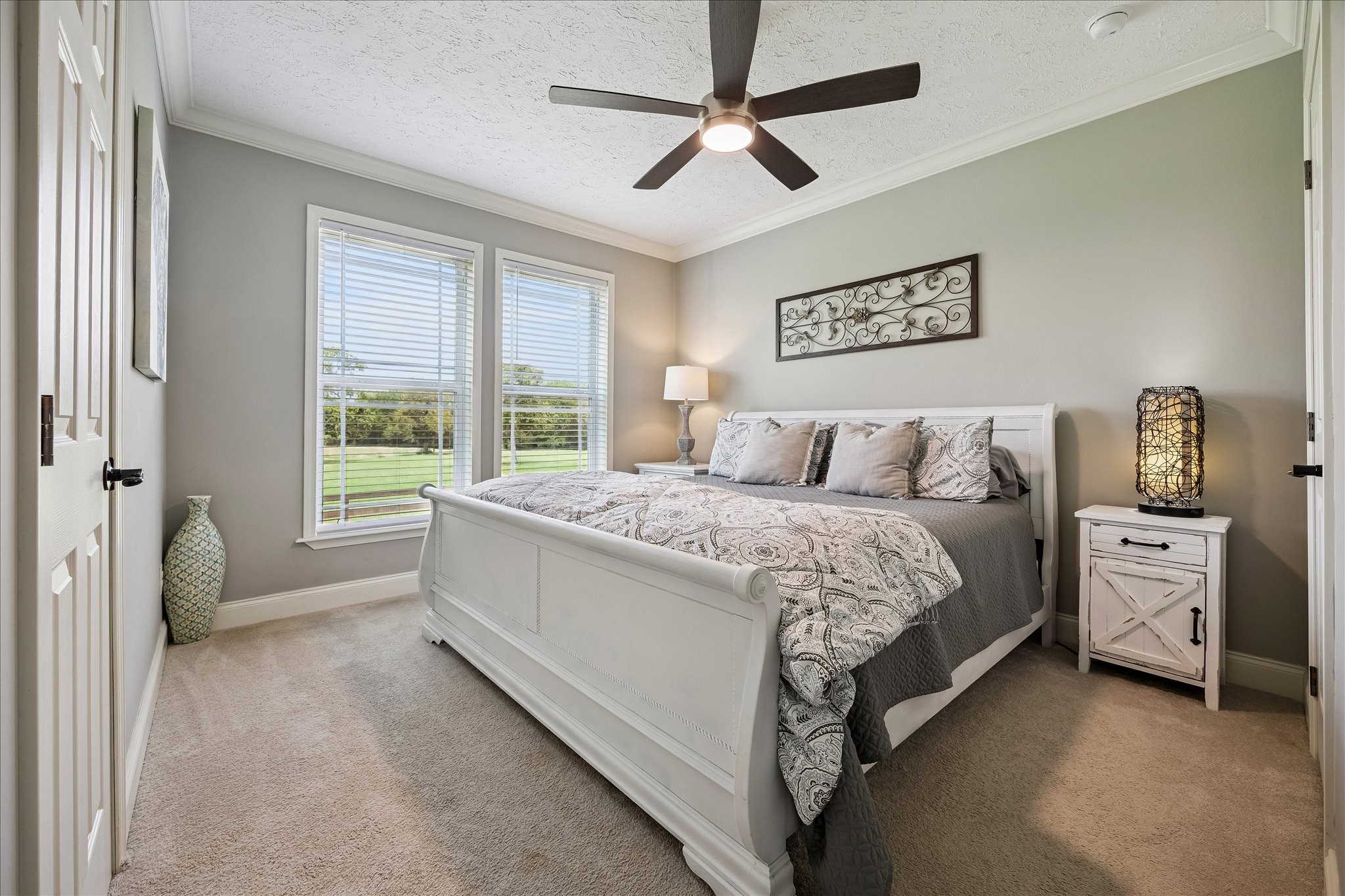 15946 Farm To Market Road 1094 Cat Spring, TX 78933 - Photo 22 of 50 a bedroom with a large bed and a window