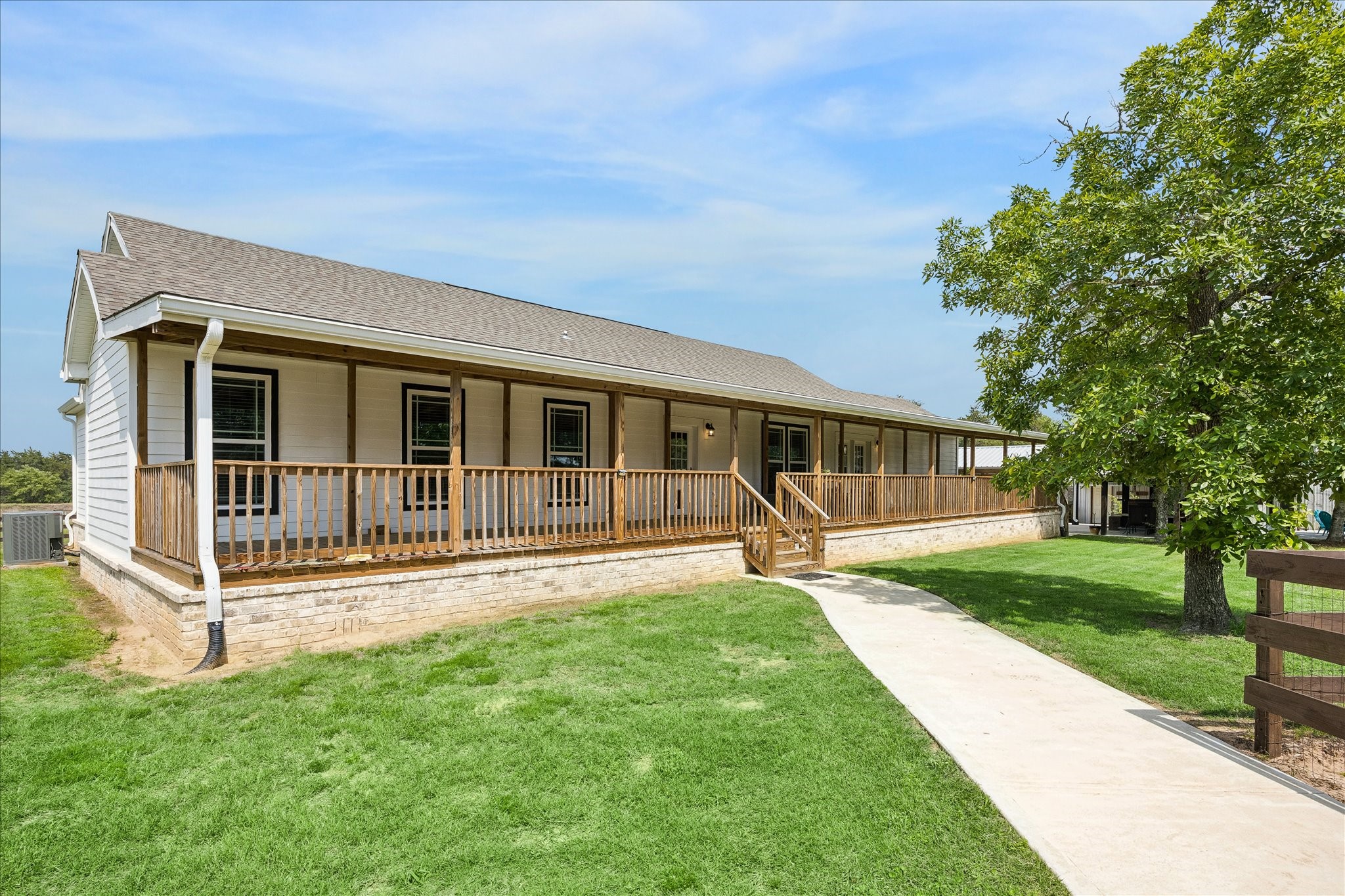 15946 Farm To Market Road 1094 Cat Spring, TX 78933 - Photo 26 of 50 a front view of a house with a yard