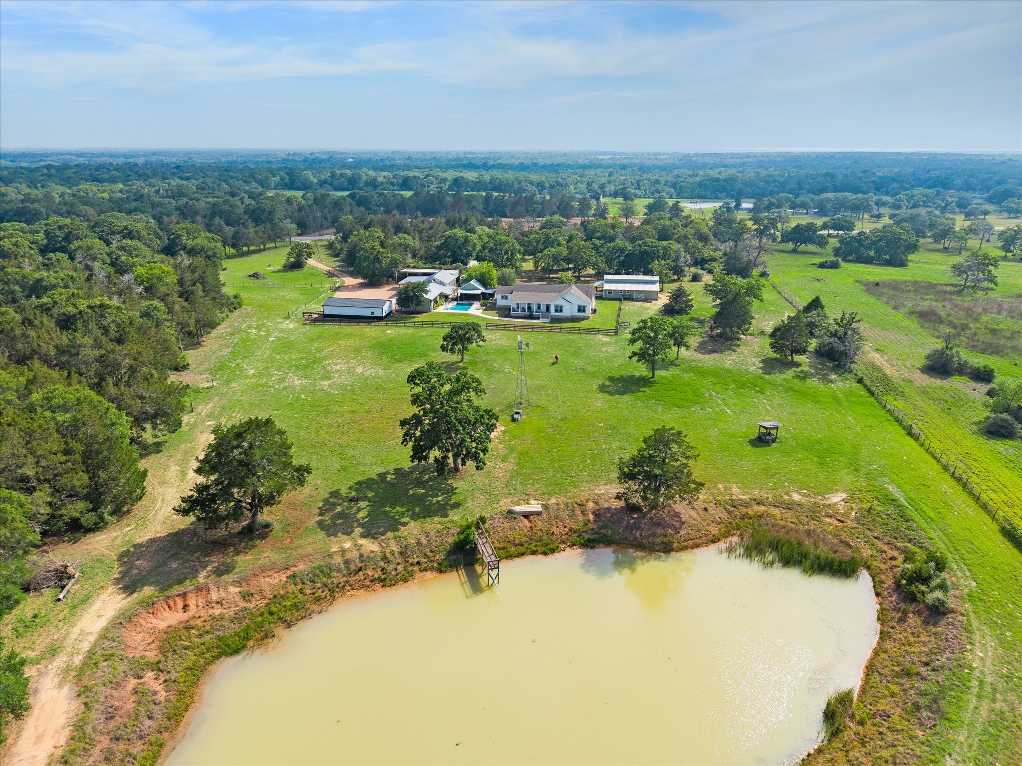 15946 Farm To Market Road 1094 Cat Spring, TX 78933 - Photo 3 of 50 a view of a lake with a houses