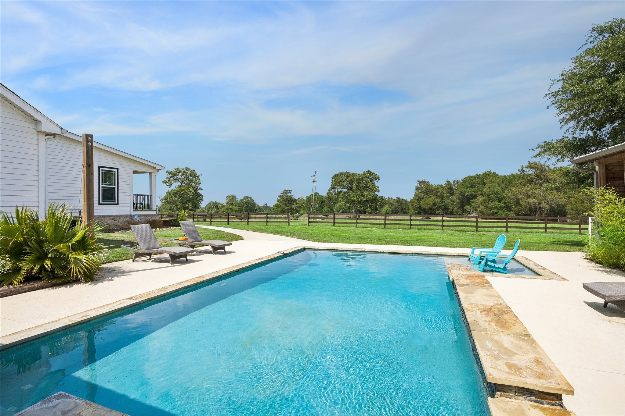 15946 Farm To Market Road 1094 Cat Spring, TX 78933 - Photo 31 of 50 a view of a patio with swimming pool