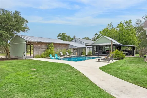 a front view of a house with a garden and porch