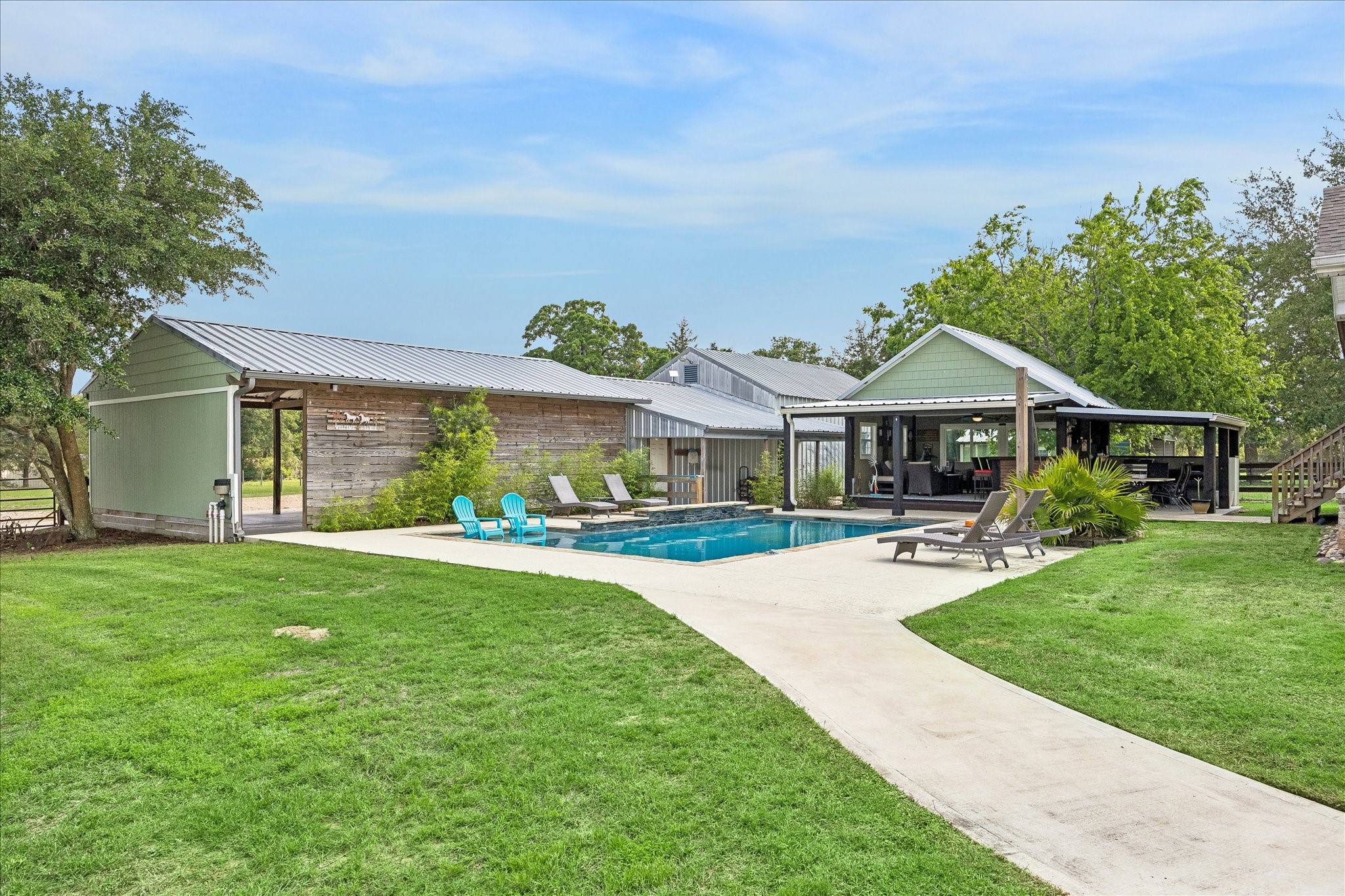 15946 Farm To Market Road 1094 Cat Spring, TX 78933 - Photo 32 of 50 a front view of a house with a garden and porch