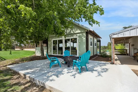 a front view of a house with porch and garden