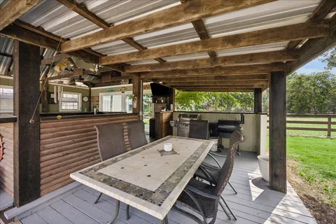 a view of a chairs and table in a patio