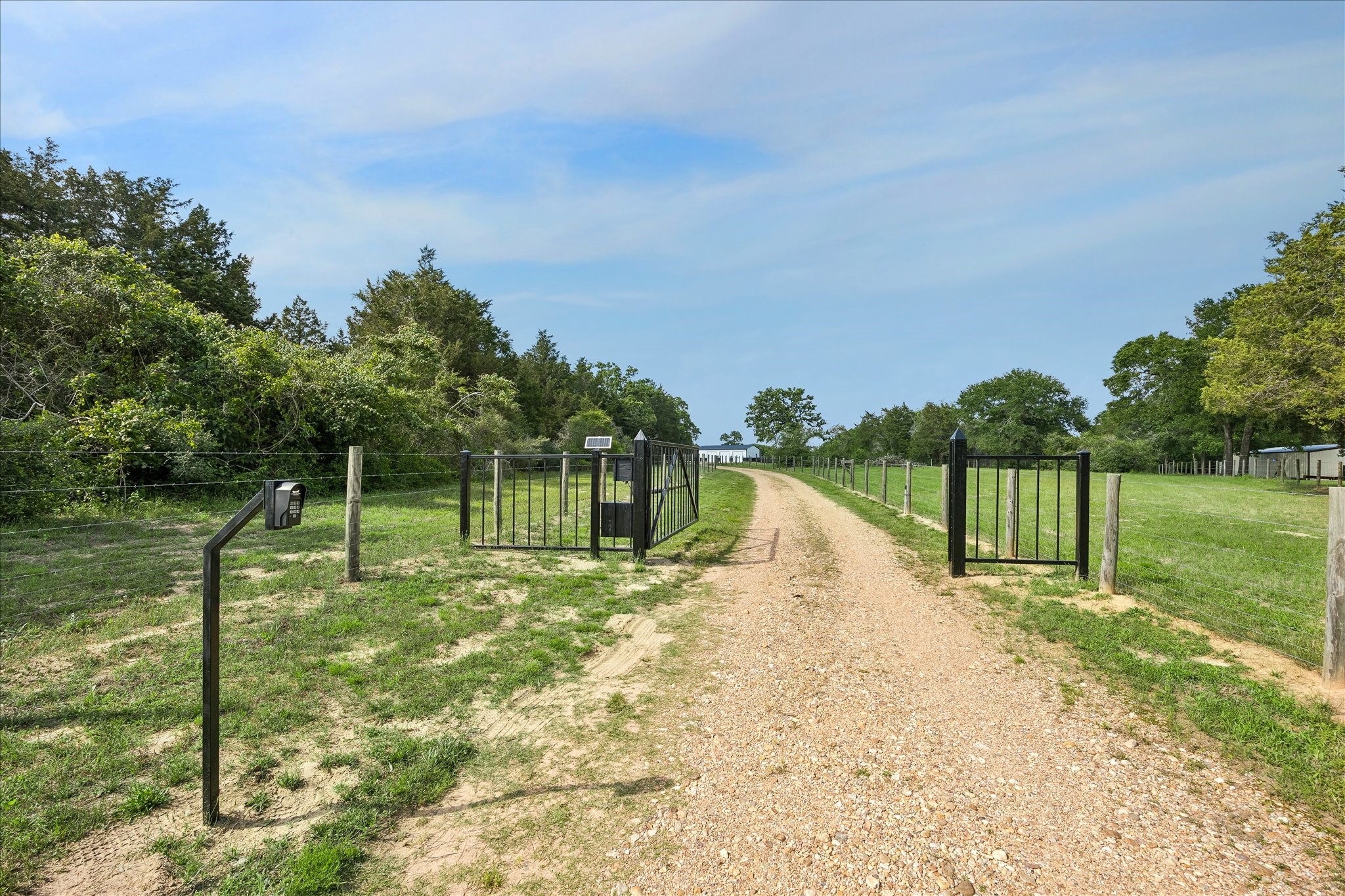 15946 Farm To Market Road 1094 Cat Spring, TX 78933 - Photo 46 of 50 a view of a swimming pool with a patio and a yard