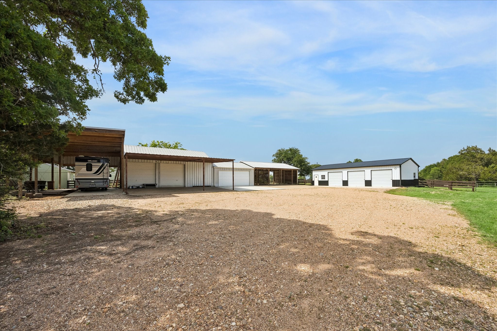 15946 Farm To Market Road 1094 Cat Spring, TX 78933 - Photo 47 of 50 a front view of a house with a yard and garage