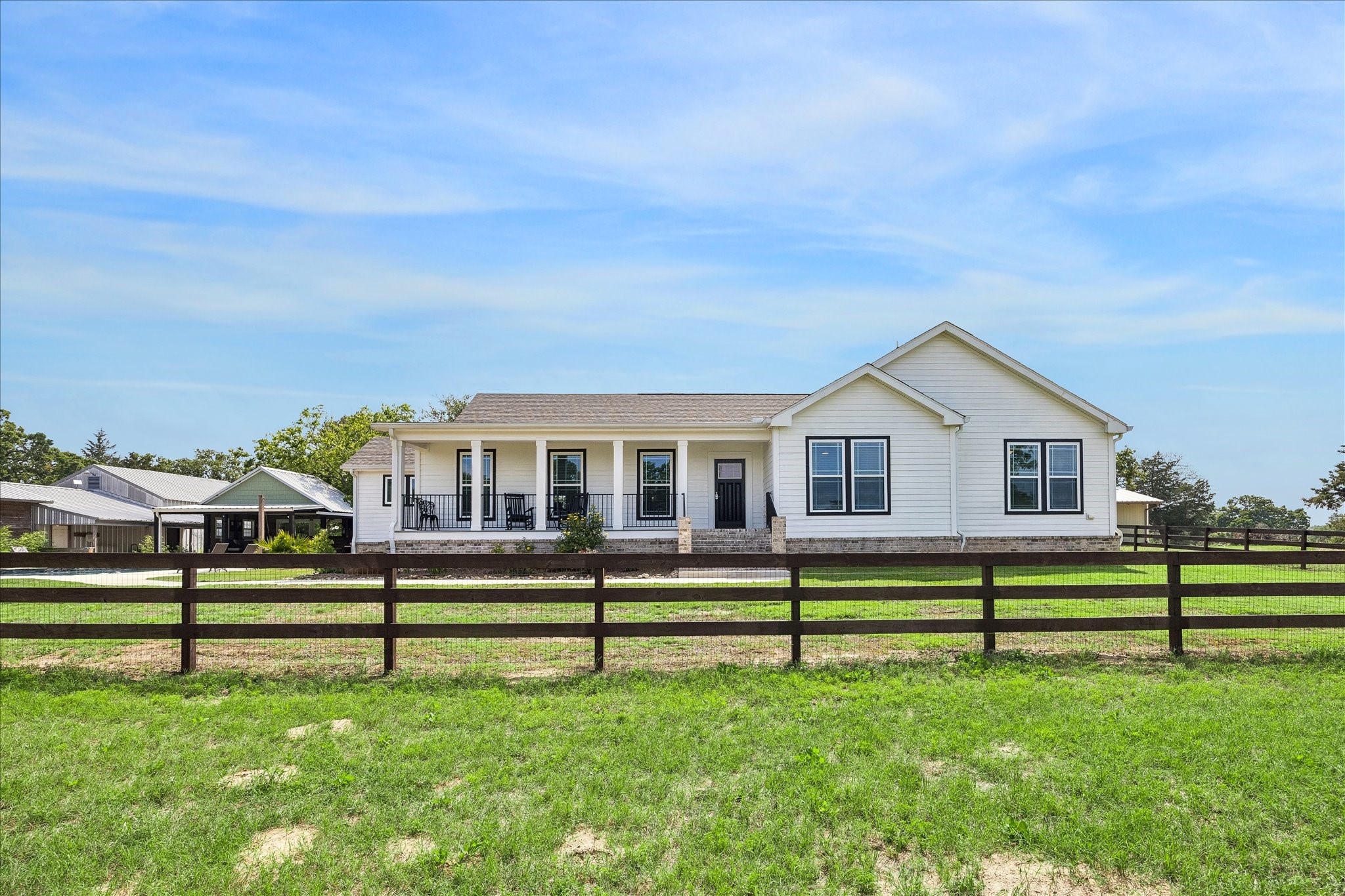 15946 Farm To Market Road 1094 Cat Spring, TX 78933 - Photo 5 of 50 a front view of a house with a yard