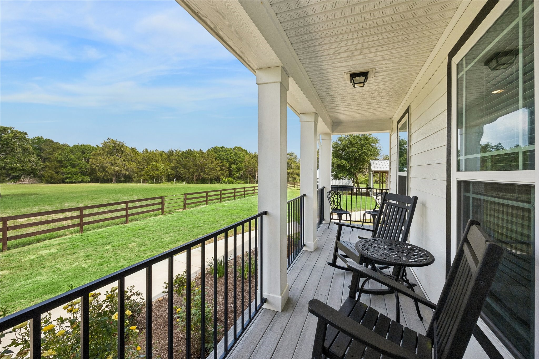 15946 Farm To Market Road 1094 Cat Spring, TX 78933 - Photo 7 of 50 a view of a two chair in the deck next to a yard