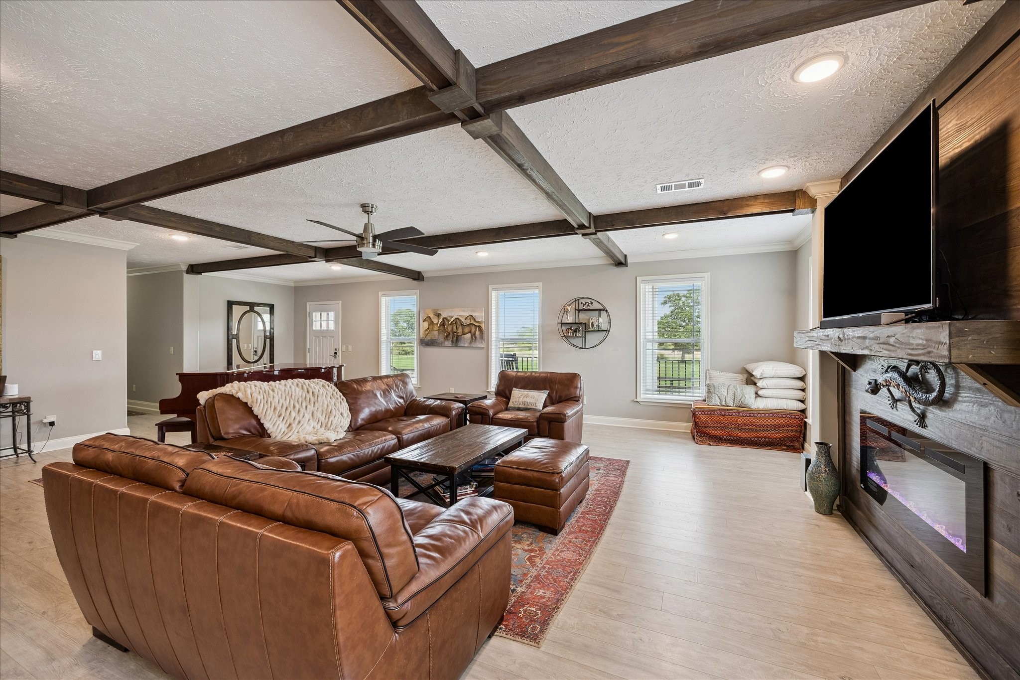 15946 Farm To Market Road 1094 Cat Spring, TX 78933 - Photo 9 of 50 a living room with furniture and a flat screen tv