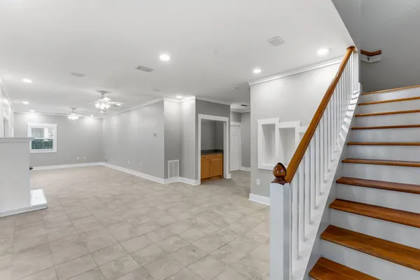 a view of an entryway with wooden floor and windows