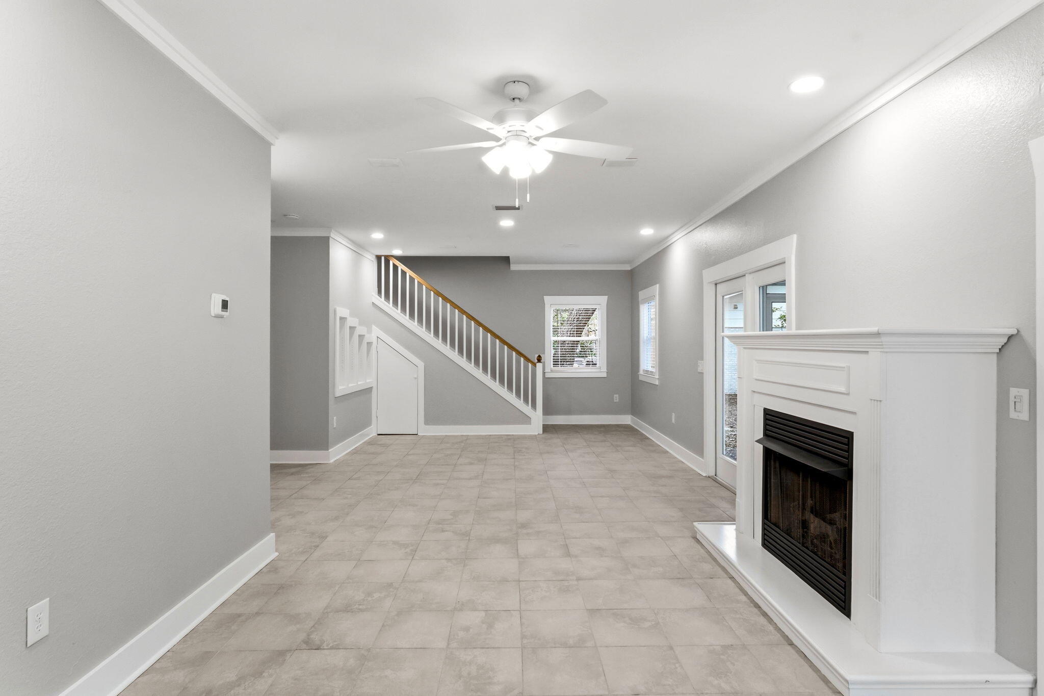 128 Bay Magnolia Lane Santa Rosa Beach, FL 32459 - Photo 15 of 61 wooden floor fireplace and windows in an empty room