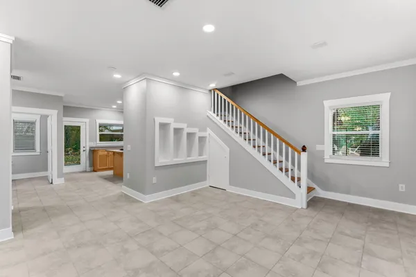 a kitchen with stainless steel appliances kitchen island a stove a sink and a refrigerator