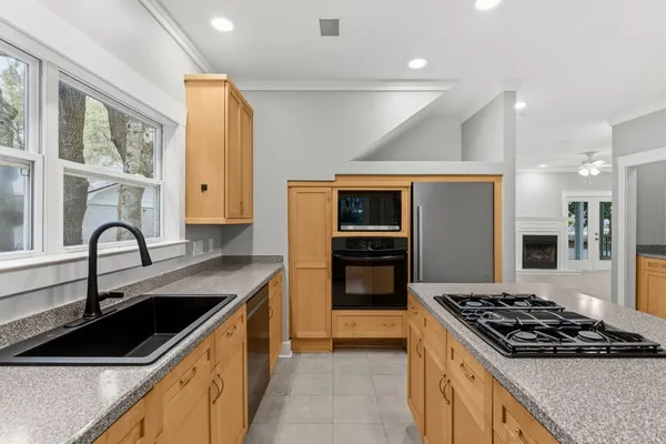 a spacious bathroom with a mirror and a shower