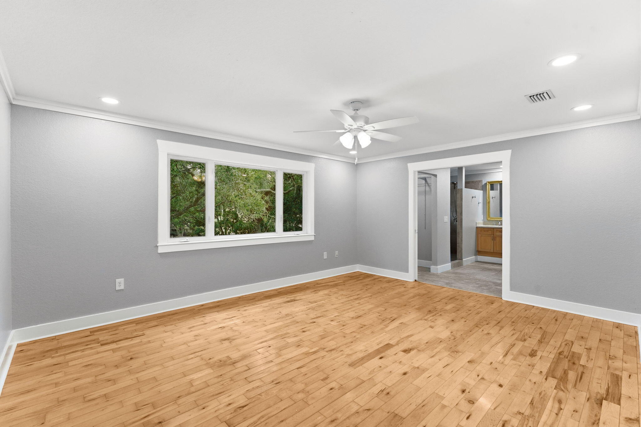 128 Bay Magnolia Lane Santa Rosa Beach, FL 32459 - Photo 23 of 61 a view of an empty room with window and chandelier fan