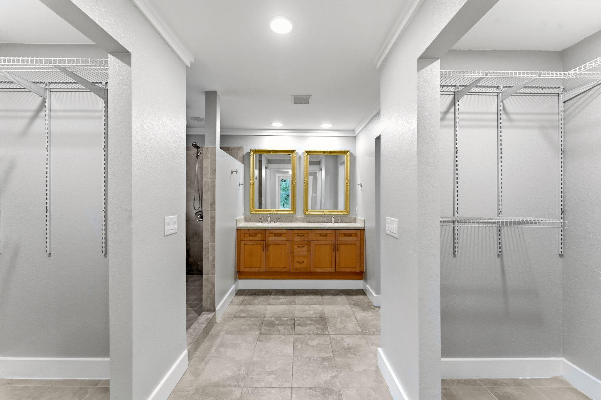 128 Bay Magnolia Lane Santa Rosa Beach, FL 32459 - Photo 24 of 61 a bathroom with a glass shower door and a mirror
