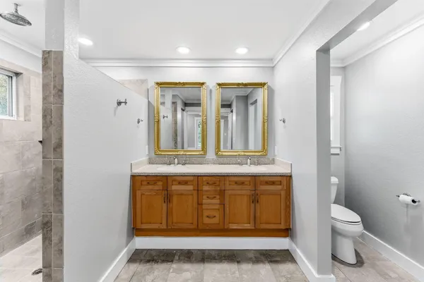 a bathroom with a sink a toilet and bathtub