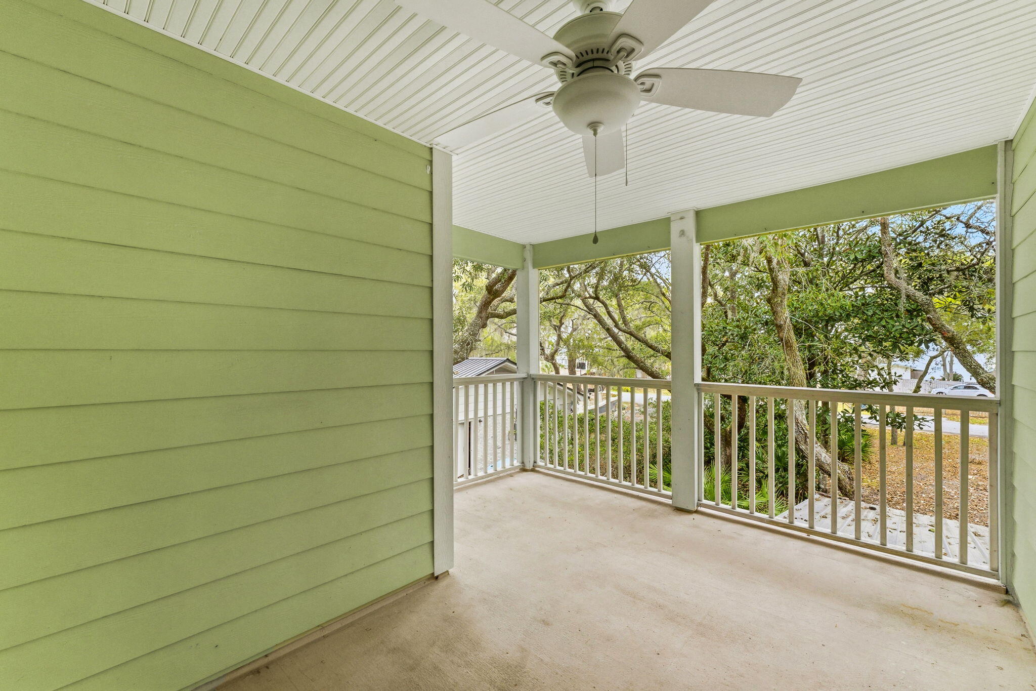 128 Bay Magnolia Lane Santa Rosa Beach, FL 32459 - Photo 29 of 61 a view of a balcony with a ceiling fan