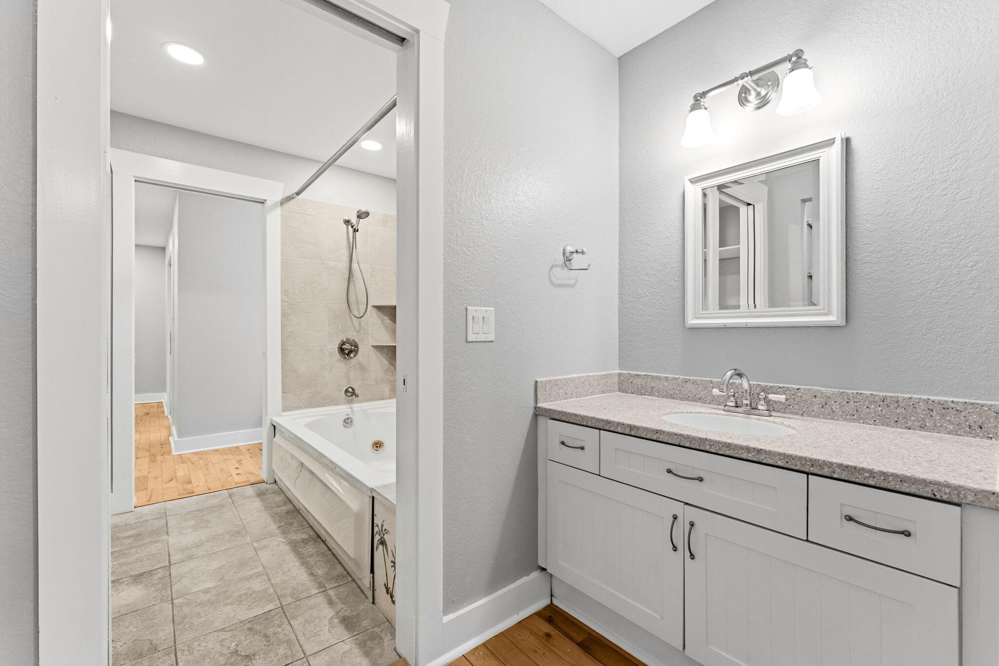 128 Bay Magnolia Lane Santa Rosa Beach, FL 32459 - Photo 33 of 61 a spacious bathroom with a double vanity sink a mirror and a bathtub