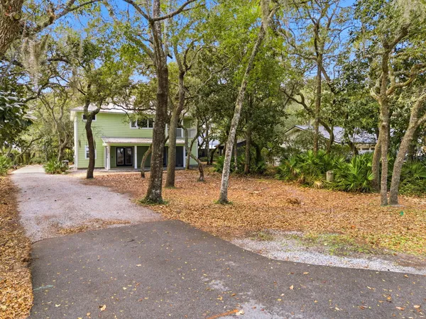 a view of a swimming pool with outdoor seating