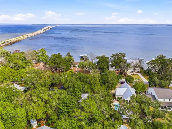 a house with swimming pool in front of it