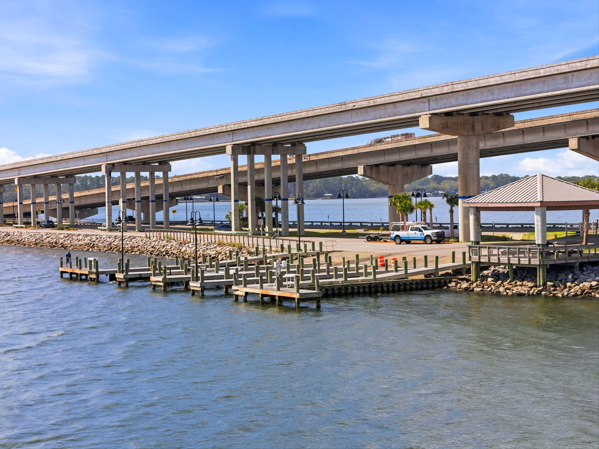 128 Bay Magnolia Lane Santa Rosa Beach, FL 32459 - Photo 59 of 61 a room with lots of wooden furniture and a table
