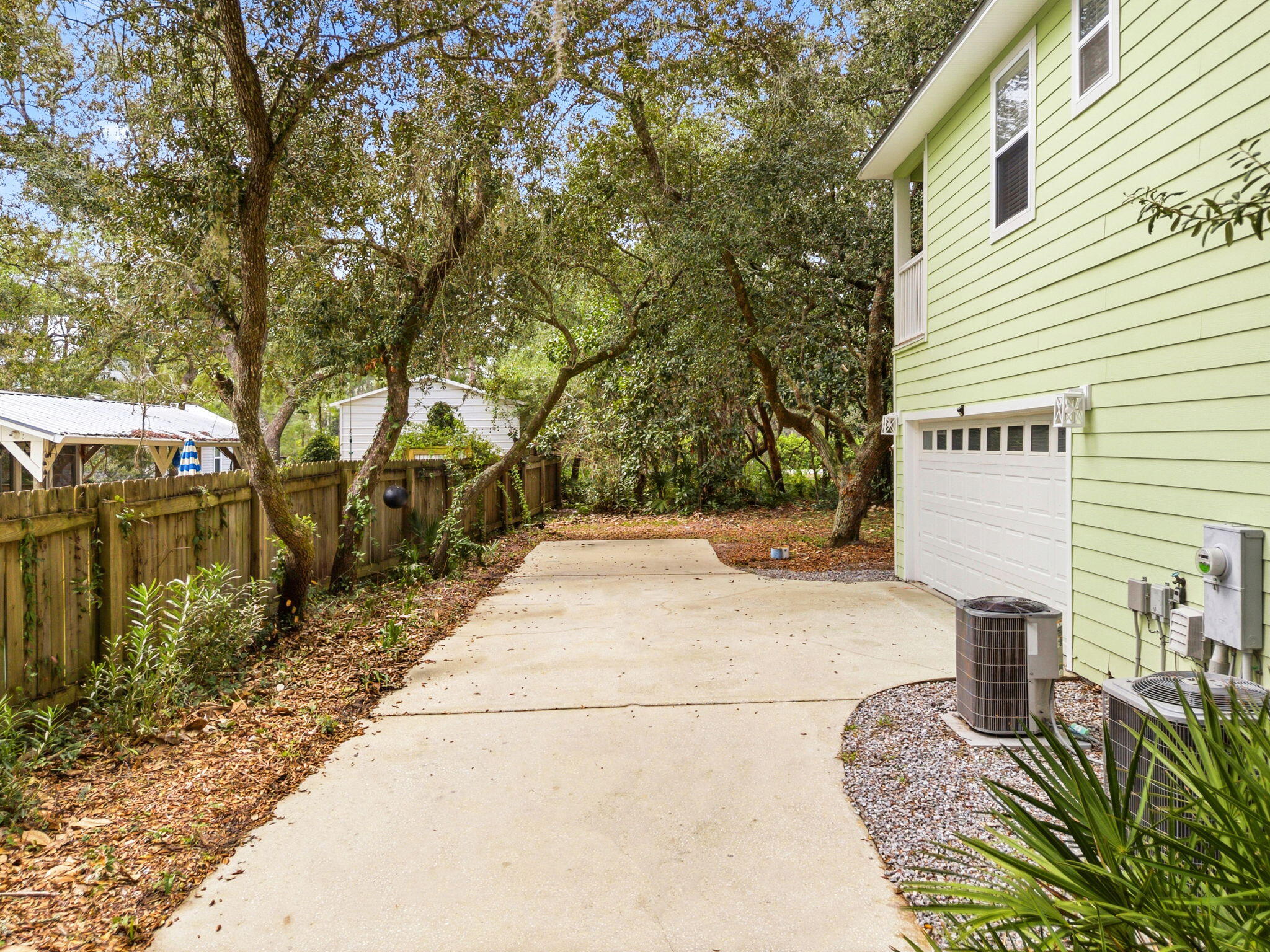 128 Bay Magnolia Lane Santa Rosa Beach, FL 32459 - Photo 6 of 61 a pathway of a house with a yard