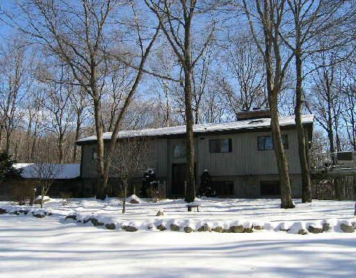 a view of a house with a snow