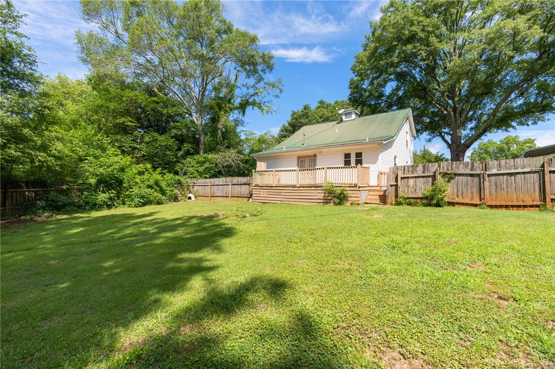 108 Tarrant Street Central, SC 29630 - Photo 35 of 42 A spacious backyard with mature trees offers a private oasis for outdoor enjoyment.