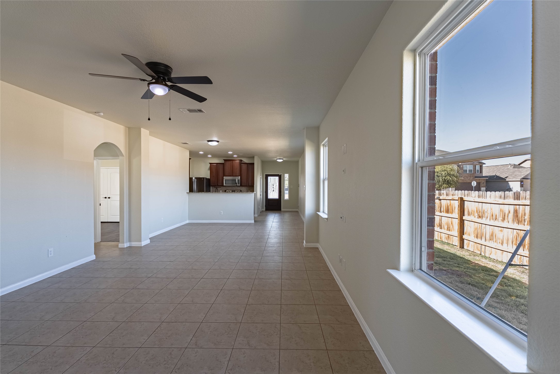 a view of a hallway with a chandelier