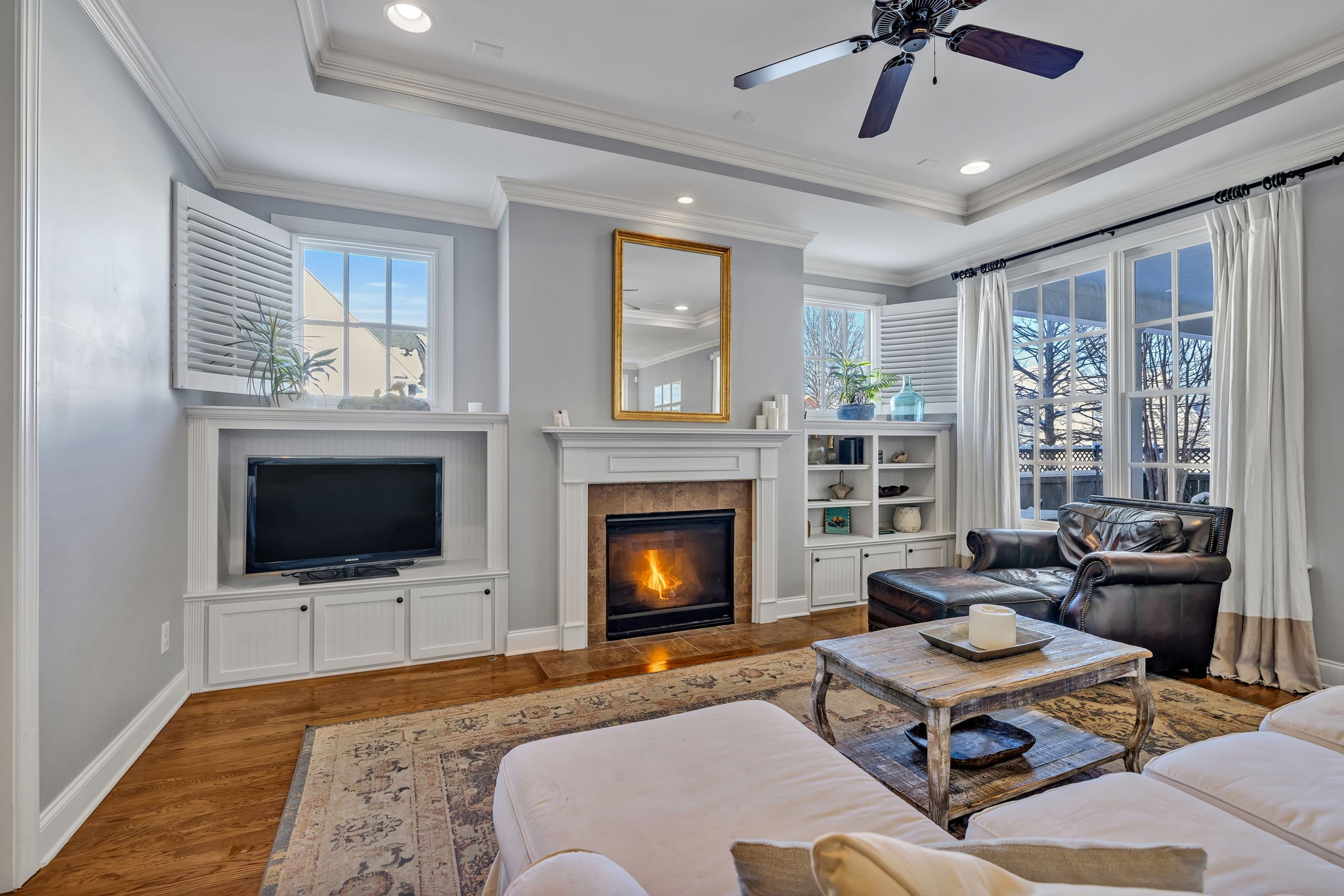 1302 Jewell Avenue Franklin, TN 37064 - Photo 17 of 68 a living room with furniture a fireplace and a flat screen tv