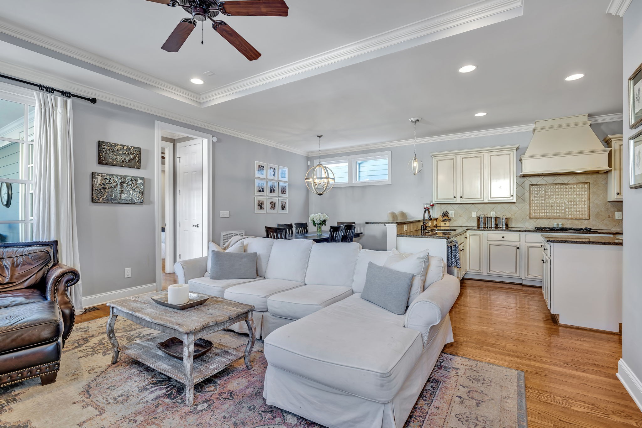 1302 Jewell Avenue Franklin, TN 37064 - Photo 22 of 68 a living room with furniture kitchen view and a wooden floor