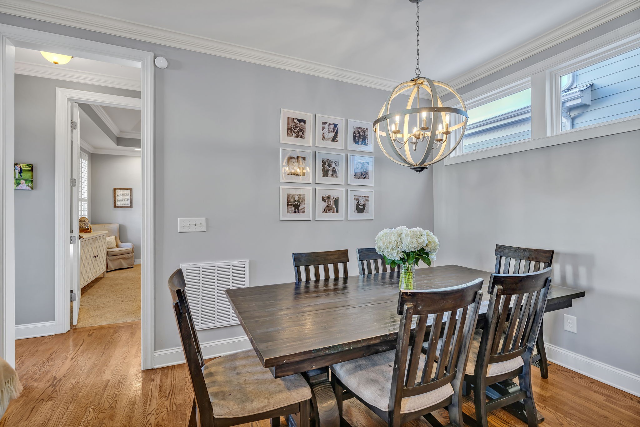 1302 Jewell Avenue Franklin, TN 37064 - Photo 26 of 68 a view of a dining room with furniture a chandelier and wooden floor