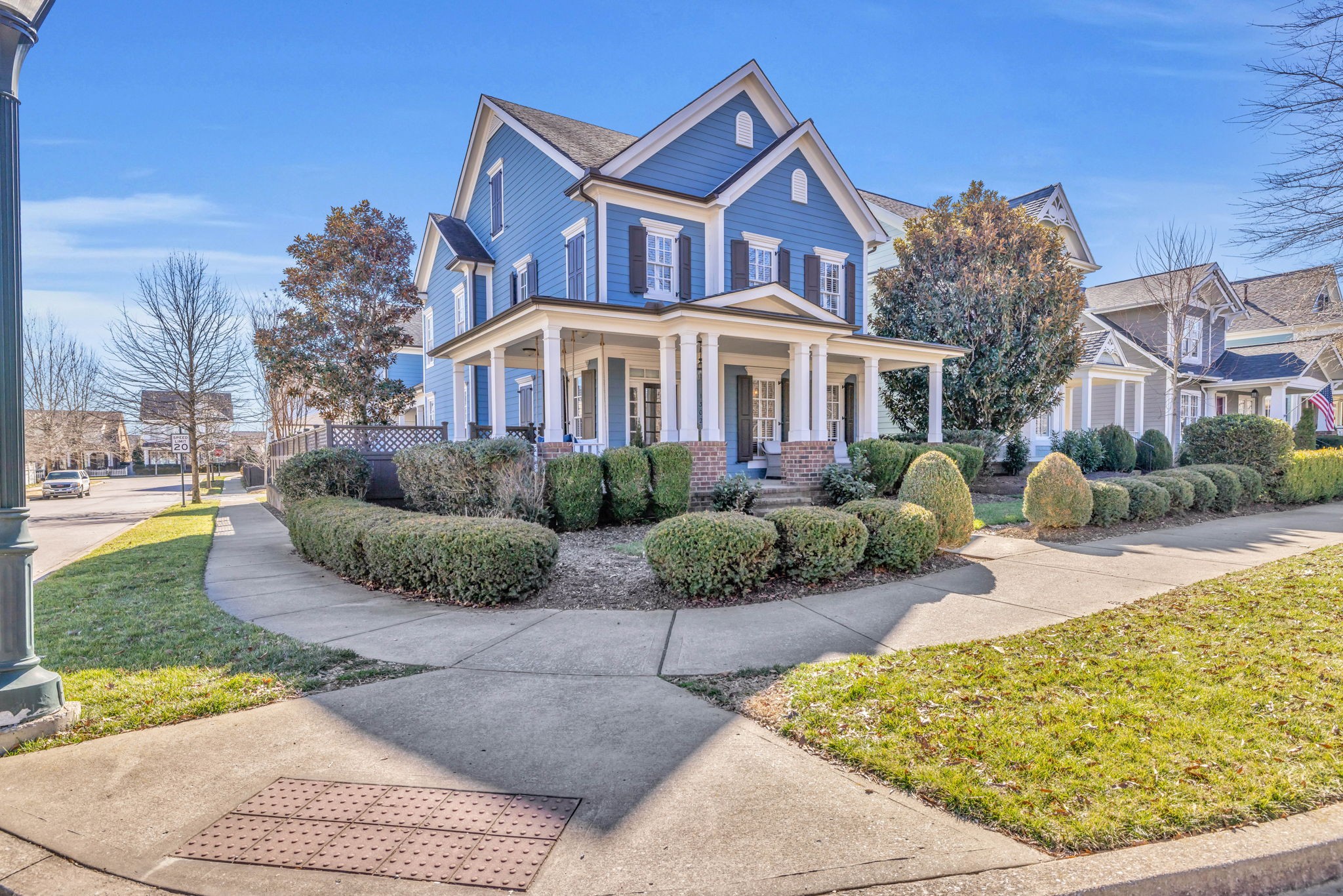 1302 Jewell Avenue Franklin, TN 37064 - Photo 3 of 68 a view of a white house next to a yard with potted plants