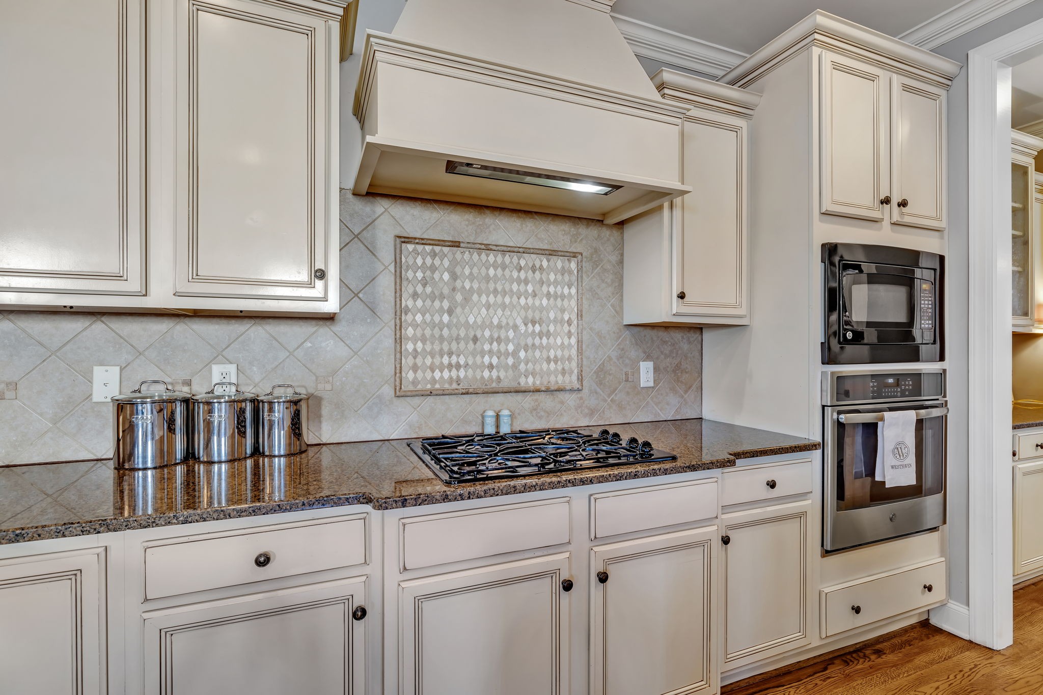 1302 Jewell Avenue Franklin, TN 37064 - Photo 34 of 68 a kitchen with white cabinets and appliances