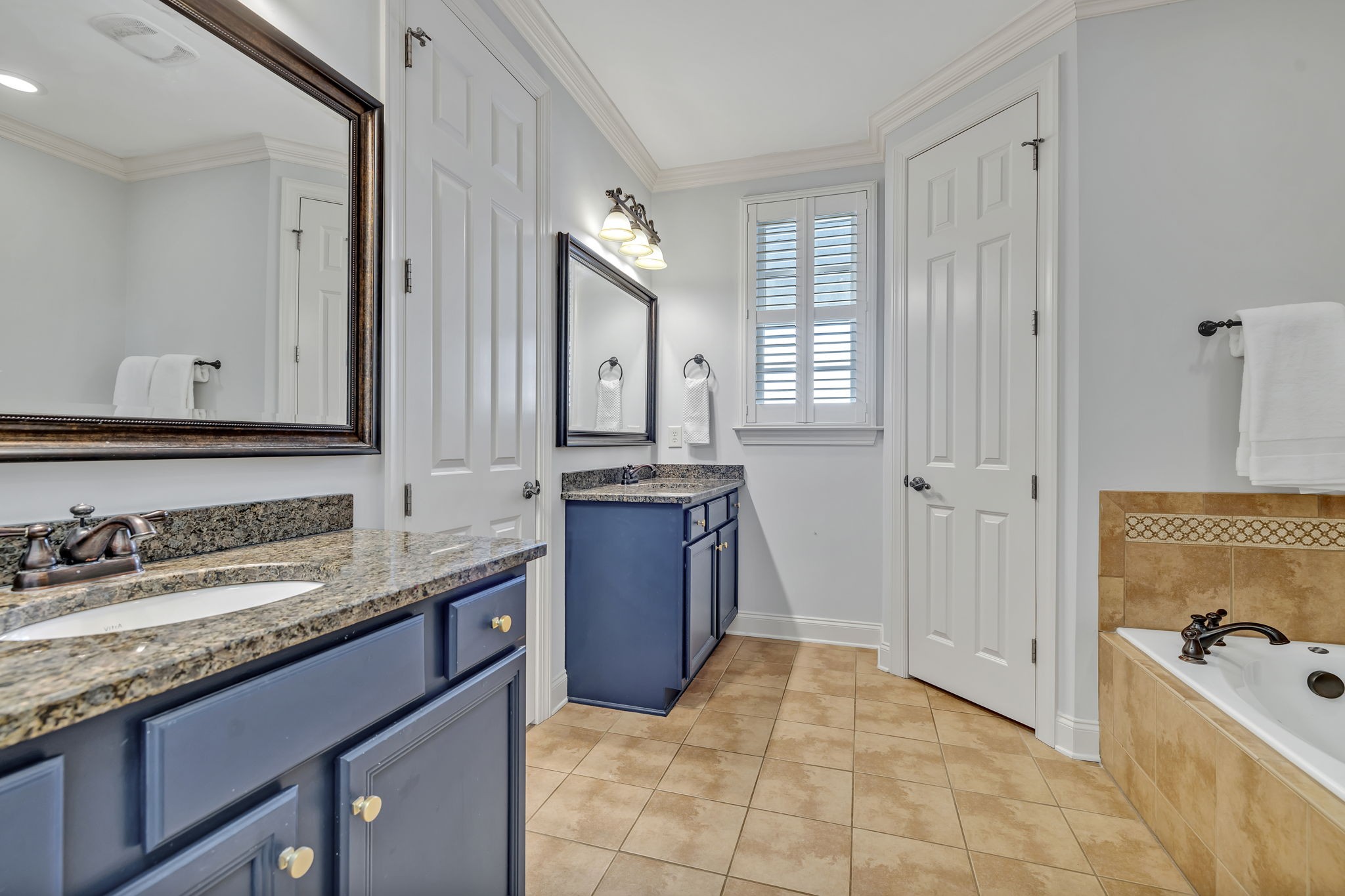 1302 Jewell Avenue Franklin, TN 37064 - Photo 46 of 68 a spacious bathroom with a granite countertop sink and a mirror
