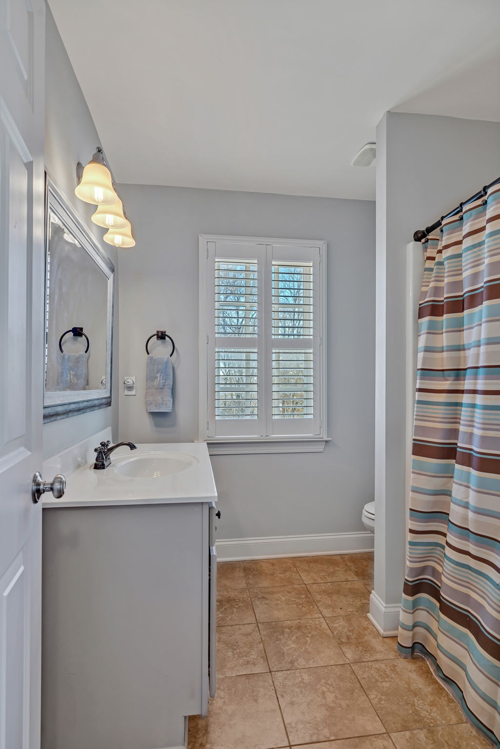 1302 Jewell Avenue Franklin, TN 37064 - Photo 52 of 68 a bathroom with a sink and a mirror