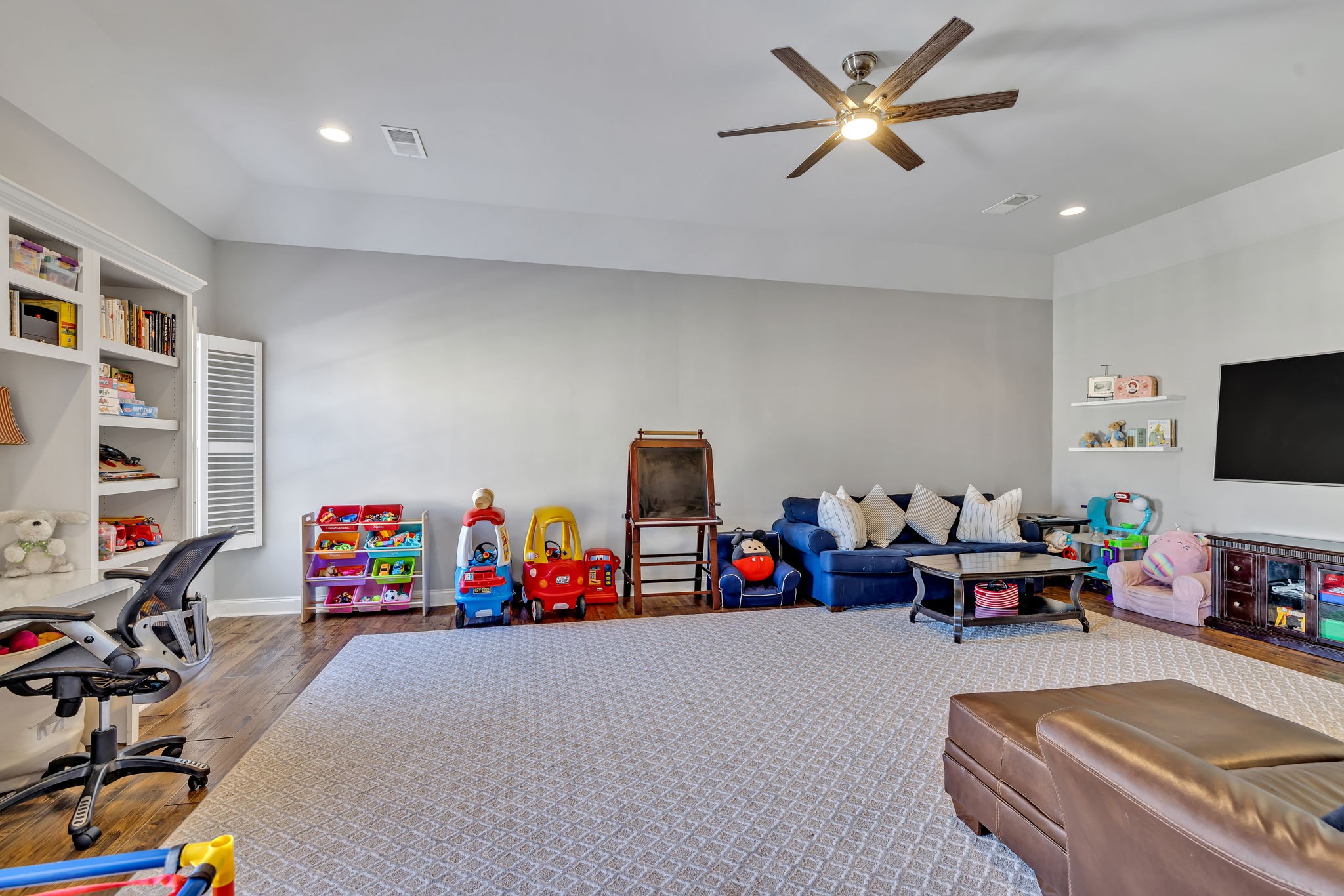 1302 Jewell Avenue Franklin, TN 37064 - Photo 55 of 68 a living room with lots of furniture and a flat screen tv