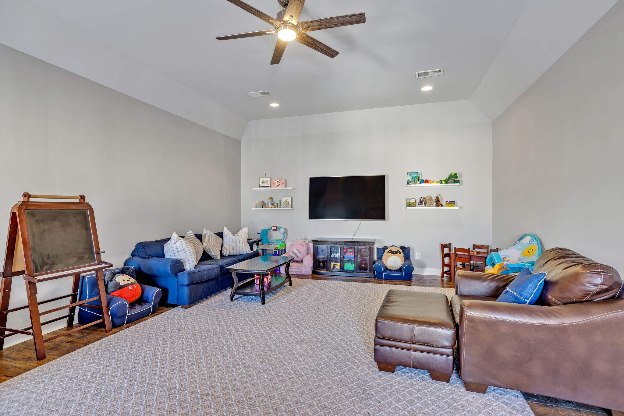 1302 Jewell Avenue Franklin, TN 37064 - Photo 56 of 68 a living room with furniture and a flat screen tv