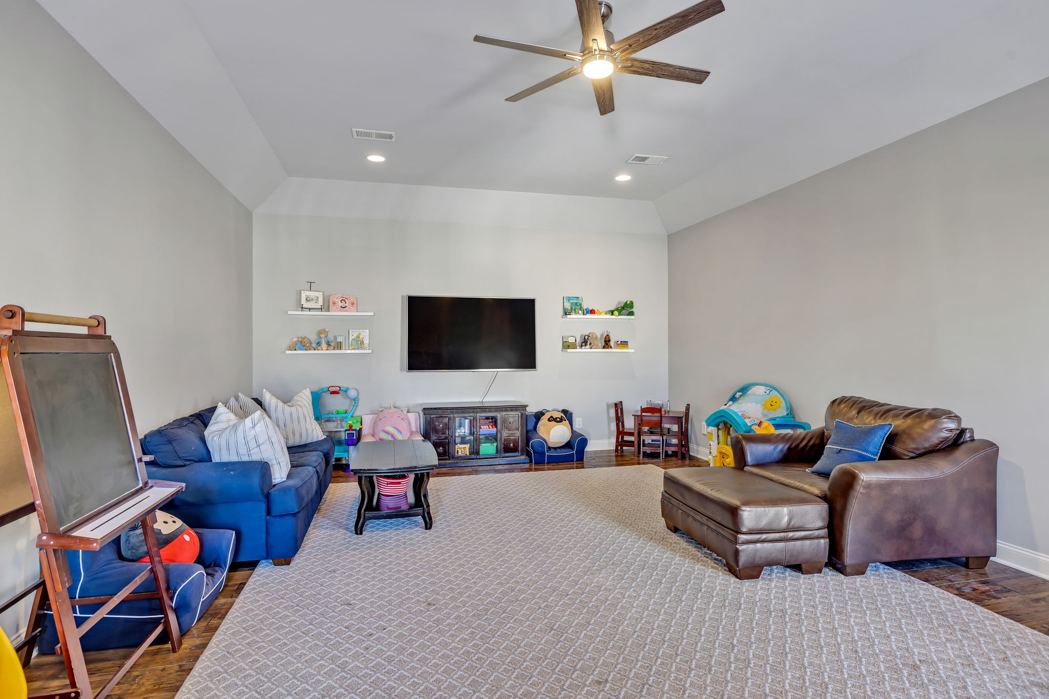 1302 Jewell Avenue Franklin, TN 37064 - Photo 57 of 68 a bedroom with furniture and a flat screen tv
