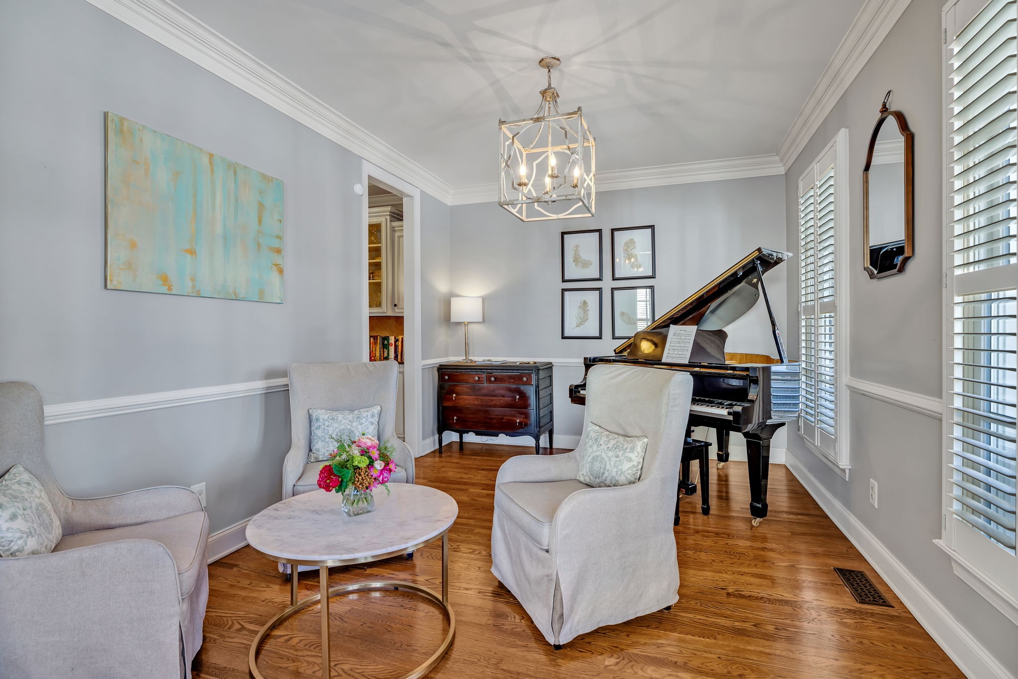 1302 Jewell Avenue Franklin, TN 37064 - Photo 9 of 68 a living room with furniture a dining table and a chandelier