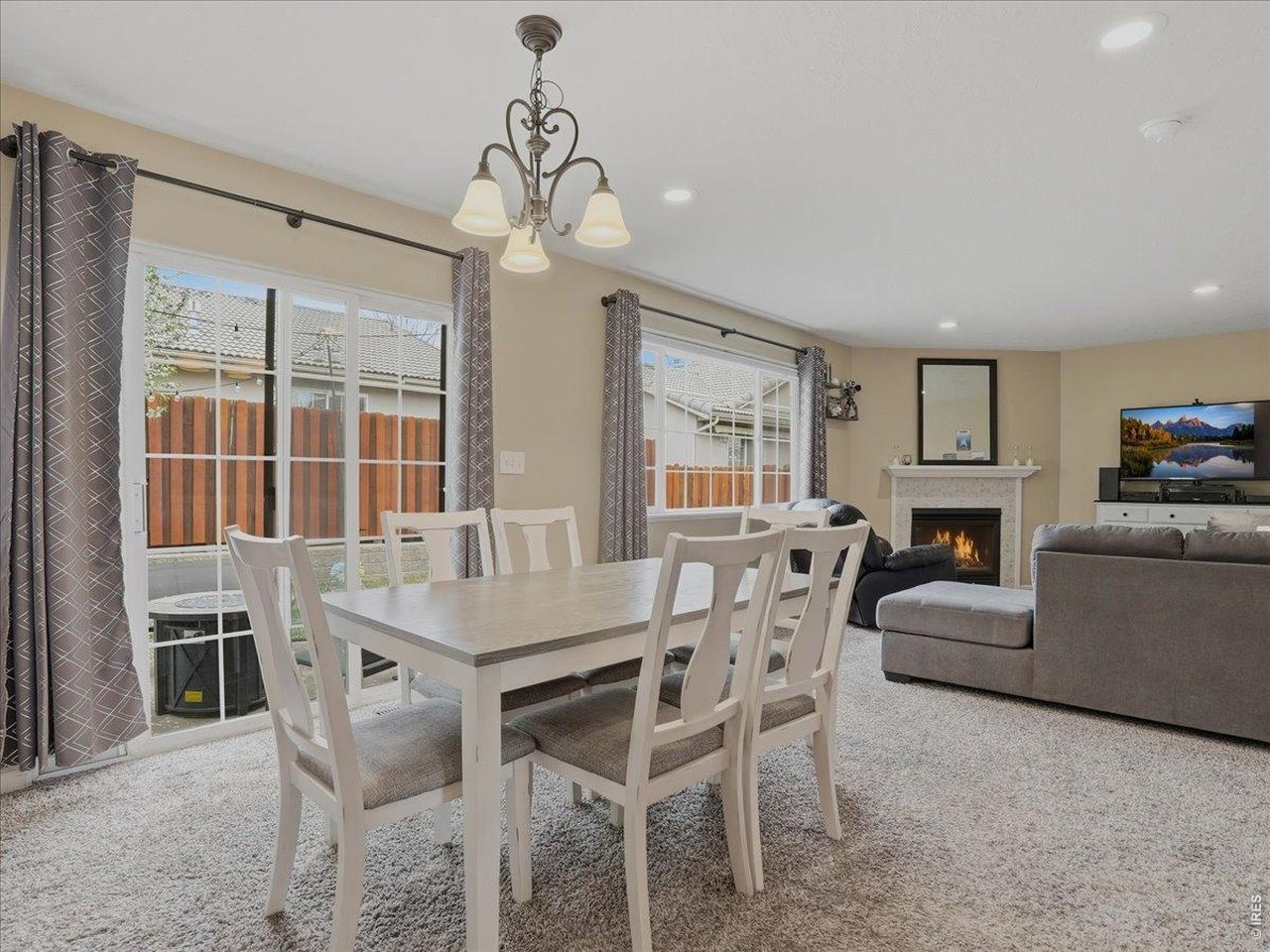 5207 West 11th Street Road Greeley, CO 80634 - Photo 14 of 38 Dining area into living room and to back patio
