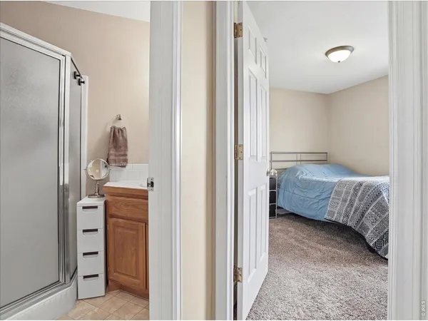 a bedroom with a bed and utility room