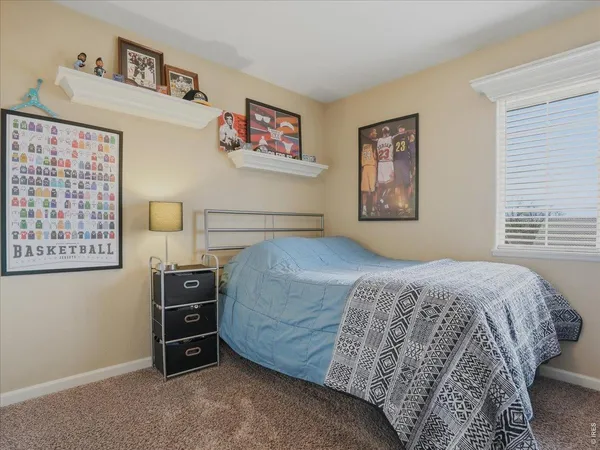 a bedroom with a bed and cabinets