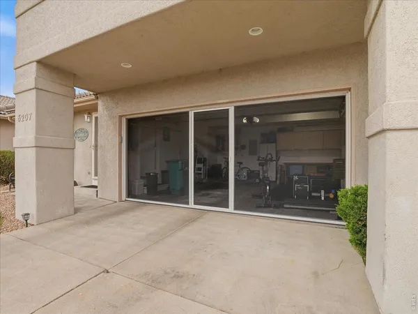 a view of a garage with cars
