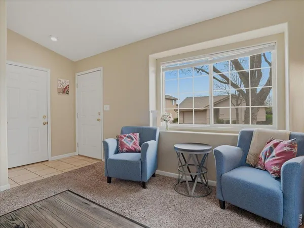 a living room with furniture a window and a couch
