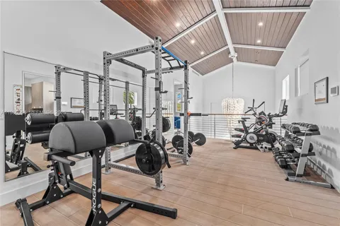 a room with lots of chairs and wooden floor
