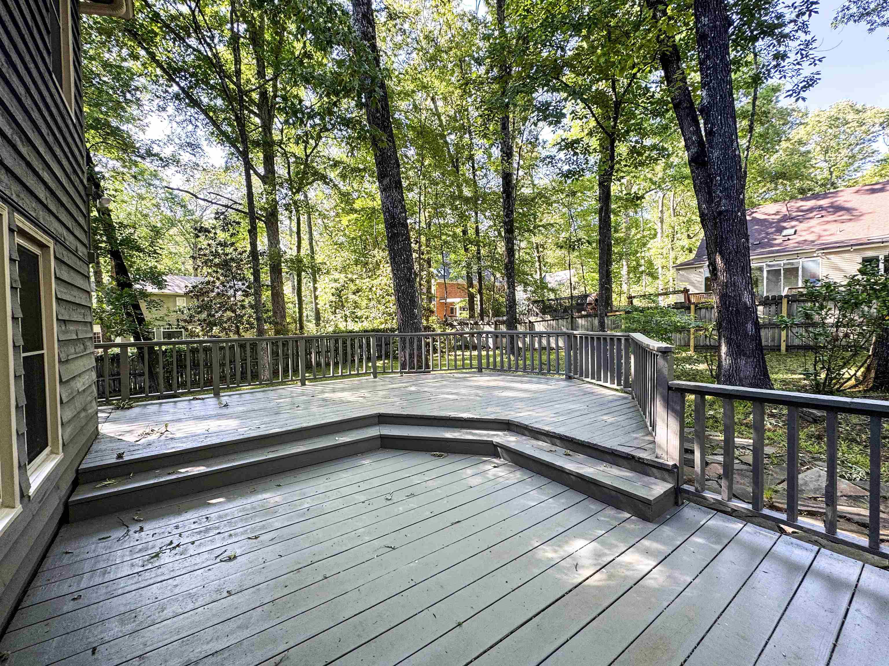 832 South Tree Drive Collierville, TN 38017 - Photo 3 of 40 Expansive wooden deck with a multi-level design and a full perimeter railing