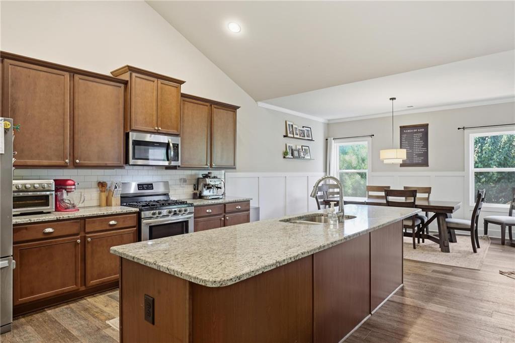 47 Violet Lane Dallas, GA 30132 - Photo 13 of 27 a kitchen with sink a microwave and cabinets