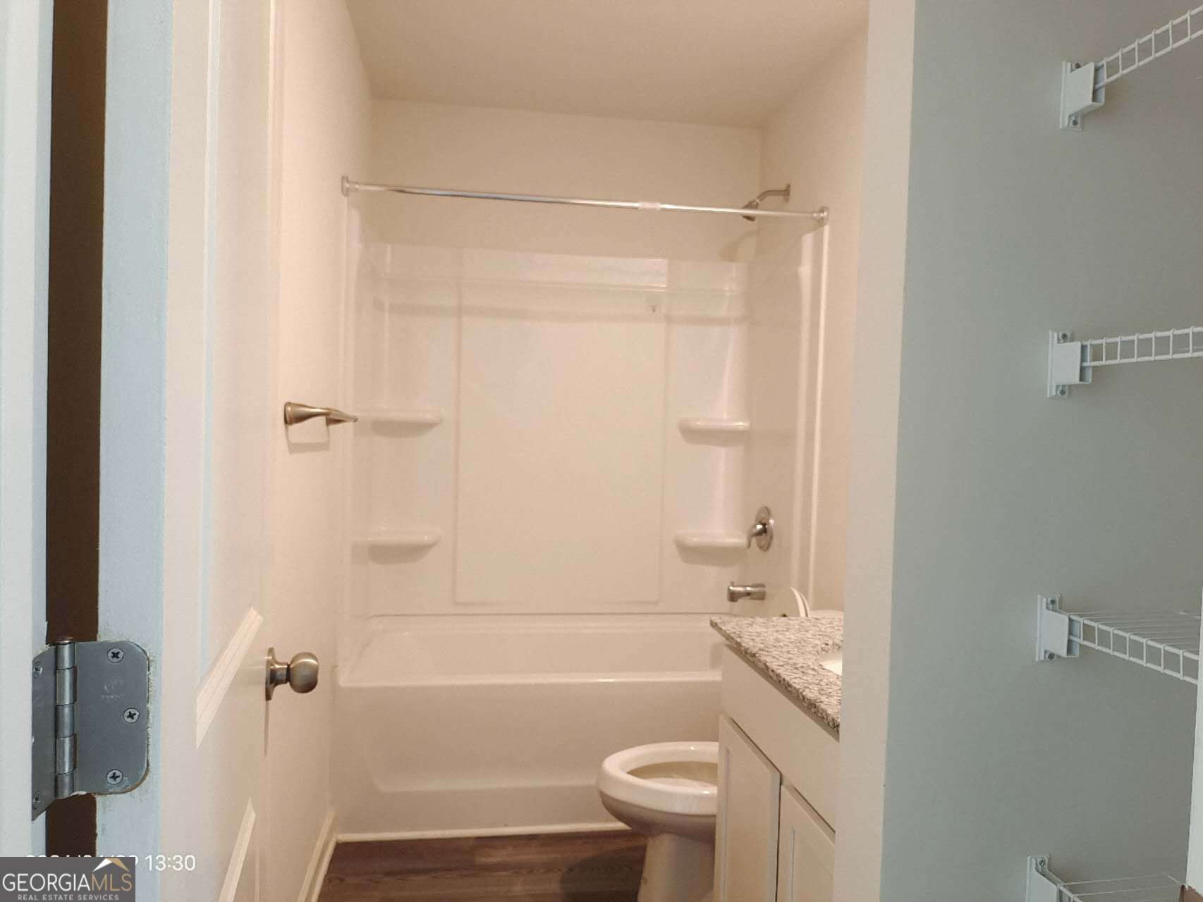 538 Pemberton Street Euharlee, GA 30145 - Photo 12 of 13 a bathroom with a granite countertop bathtub shower sink vanity and toilet
