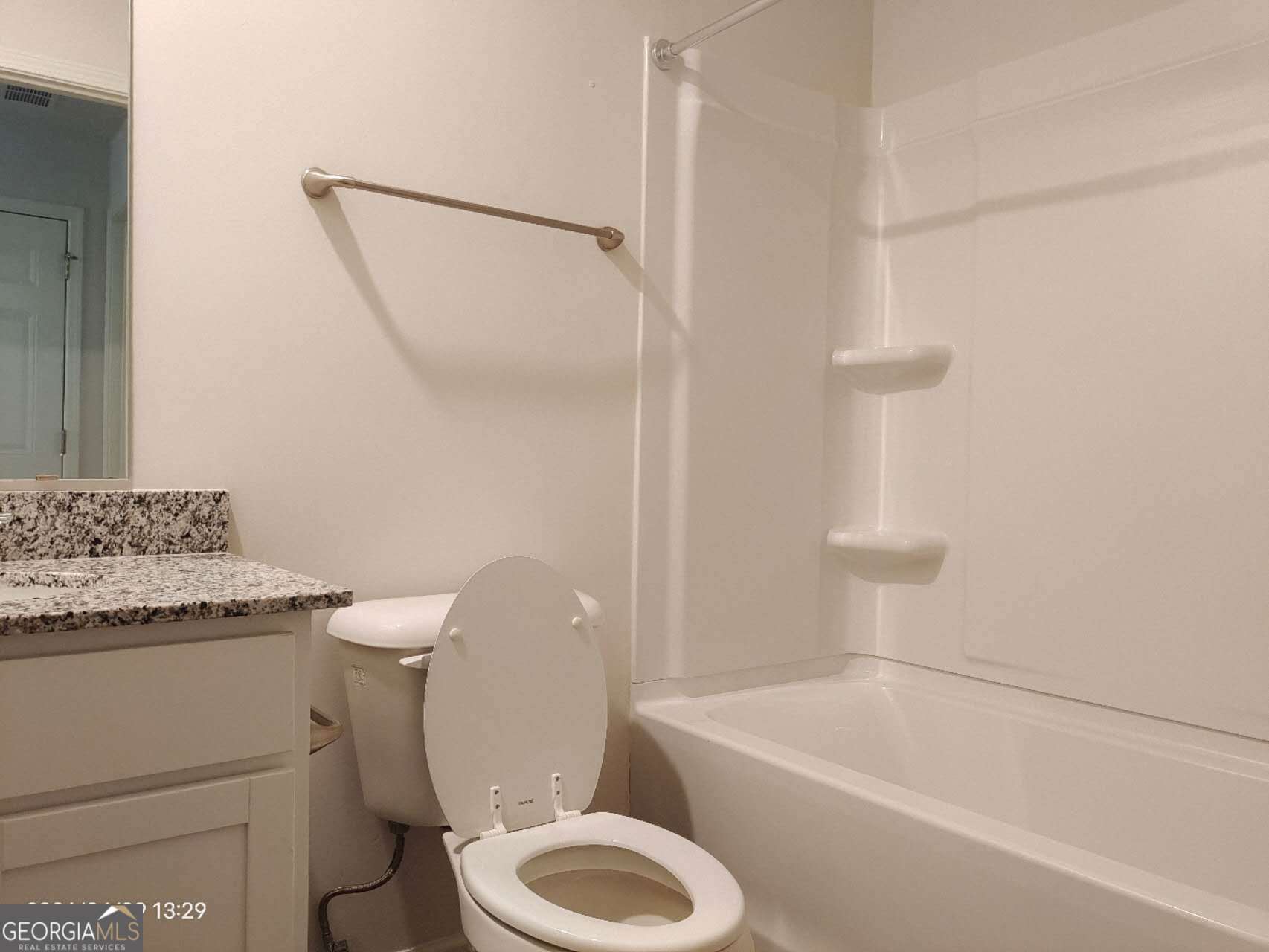 538 Pemberton Street Euharlee, GA 30145 - Photo 5 of 13 a white toilet sitting next to a bath tub